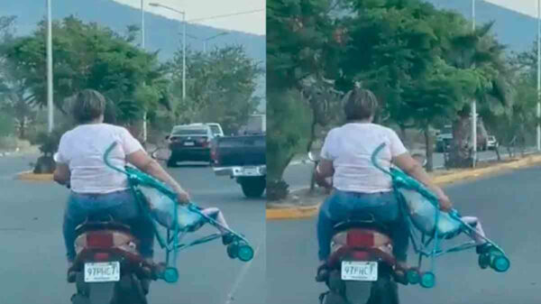 VIDEO: Pareja viaja en moto y la mujer sostiene arriesgadamente a su hijo con todo y carriola